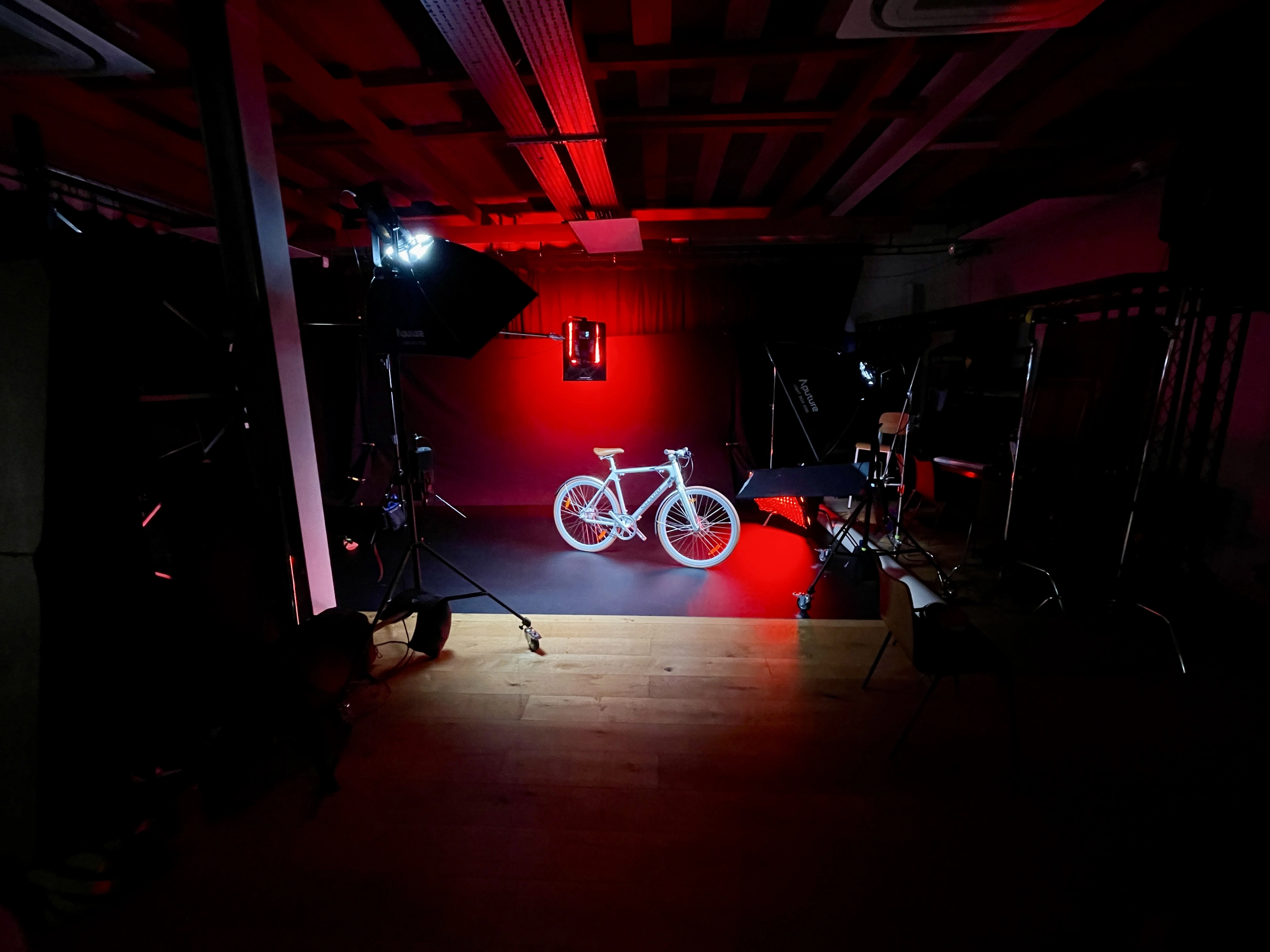 Sharp e-bike in a studio setting lit with red lighting